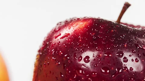 Red apple standing out from group of green and yellow apples. Close-up rotation. Video stock 63507377