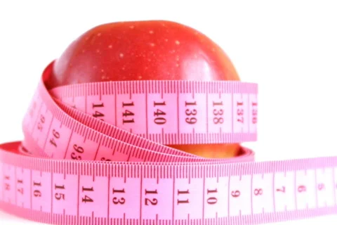Red apple with tape measure rotates , loopable Stock Footage