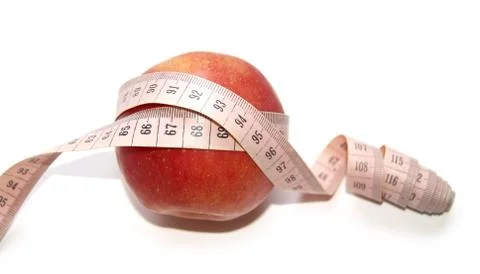 Red apple on a white background wound in the centimeter. Stock Photos