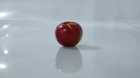 Red apple on a white background zoom in motion. Stock Footage 201291147