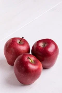 Red apple on white table Stock Photos