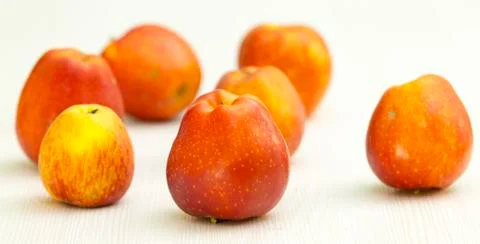 Red apple on white table Stock Photos