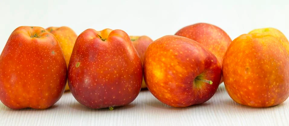 Red apple on white table Stock Photos