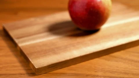 Red apple on wooden board Stock Footage 139969264