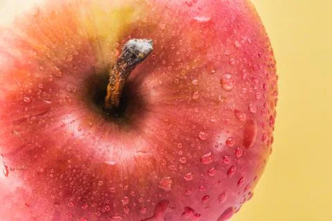 Red apple on a yellow background Stock Photos