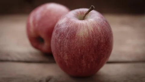 Red apples against a rustic white background HD stock footage Stock Footage 83255943