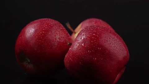 Red apples on a black background Stock Footage 150882170