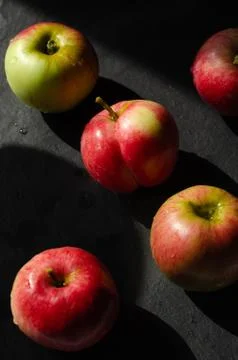 Red apples on black background Stock Photos
