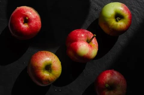 Red apples on black background Stock Photos