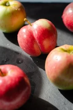 Red apples on black background Stock Photos