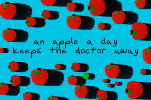 Red apples on blue background. Stock Photos