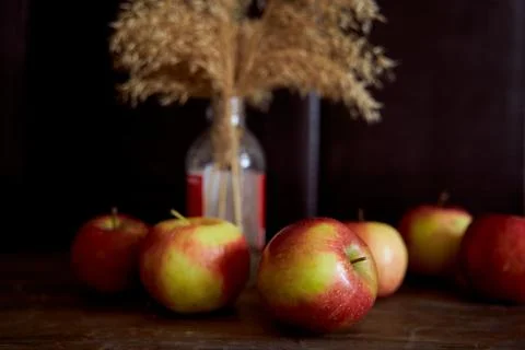 Red apples on a brown table. Close-up. Stock Photos