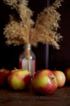 Red apples on a brown table. Close-up. Stock Photos