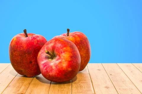 Red Apples close-up 3d rendering with realistic texture on the wooden table Stock Illustration