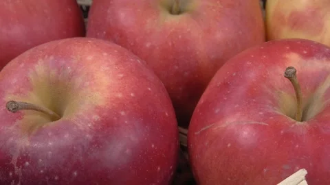 Red apples close-up. Ripe fruit on a hay. Видео 145155387