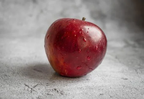 Red apples on a gray background. Fotos Stock