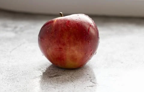 Red apples on a gray background. Fotos Stock
