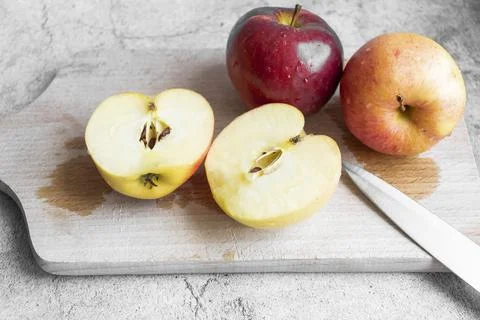 Red apples on a gray background. Stock Photos