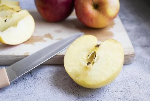 Red apples on a gray background. Stock Photos