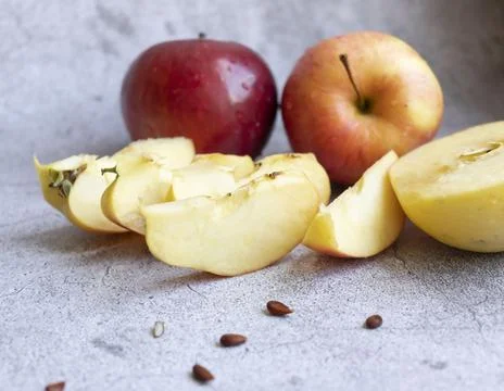 Red apples on a gray background. Fotos Stock