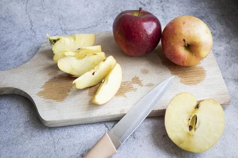 Red apples on a gray background. Stock Photos