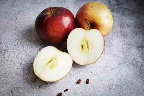 Red apples on a gray background. Fotos Stock