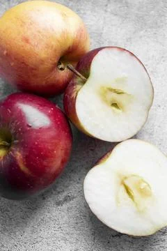Red apples on a gray background. Fotos Stock