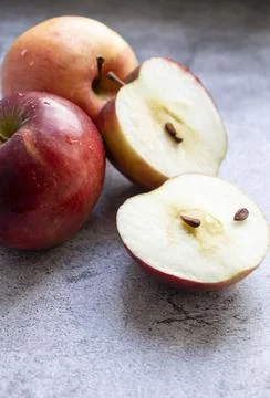 Red apples on a gray background. Fotos Stock