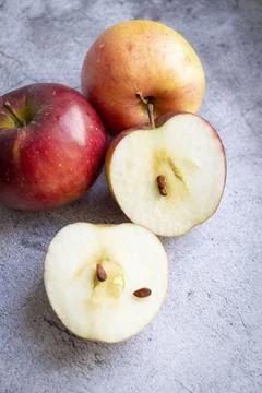 Red apples on a gray background. Fotos Stock