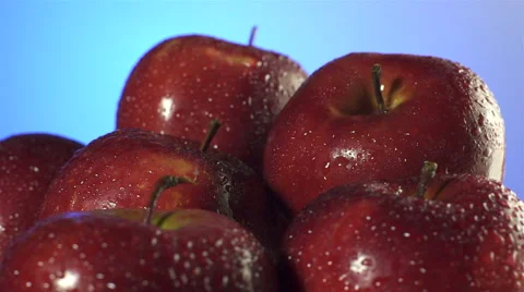 Red Apples isolated rotating on blue background Stock Footage 62412452