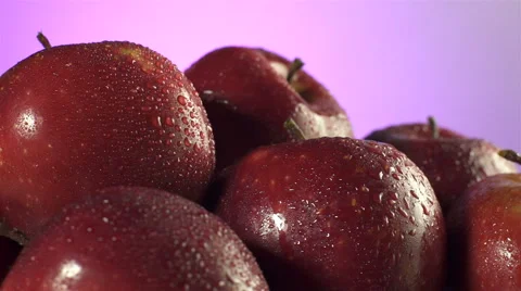 Red Apples isolated rotating on pink background Stock Footage 62412744
