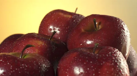 Red Apples isolated rotating on yellow background Stock Footage 62412787