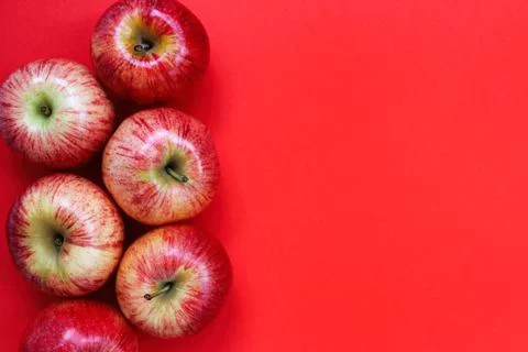 Red apples on a red background 写真素材