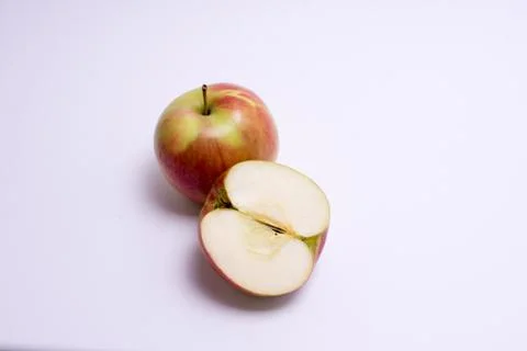Red apples with slice isolated on the white background Stock Photos