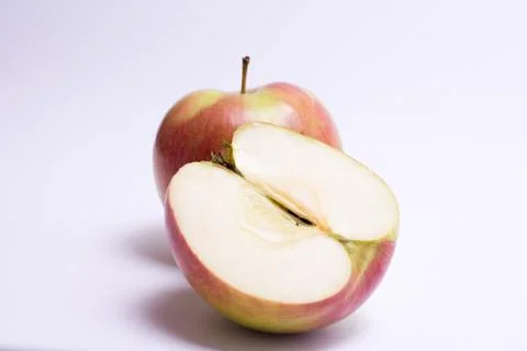 Red apples with slice isolated on the white background Stock Photos