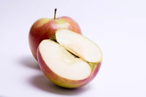 Red apples with slice isolated on the white background Stock Photos