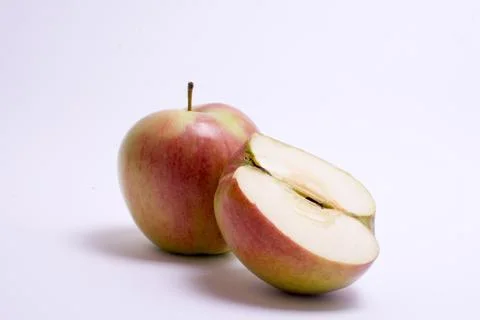Red apples with slice isolated on the white background Stock Photos