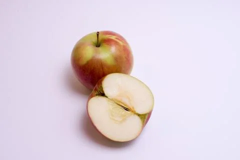Red apples with slice isolated on the white background Stock Photos