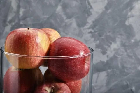 Red apples on the table. Top view with copy space on gray stone background. Stock Photos