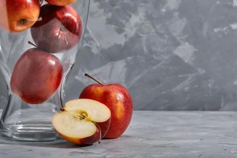 Red apples on the table. Top view with copy space on gray stone background. Stock Photos