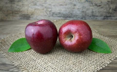 Red apples on a wooden table Stock Photos
