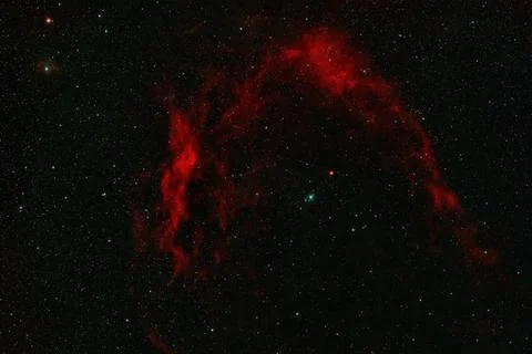 Red arching emission nebula Sharpless 2-129 Stock Photos