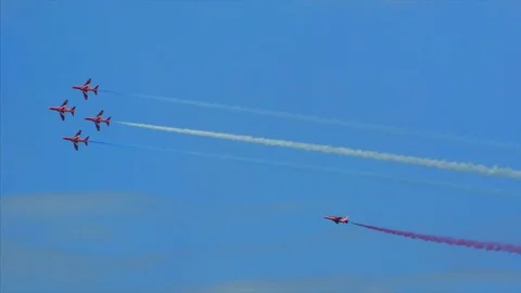 Red arrows air display formation weaving around smoke Stock Footage 77012538