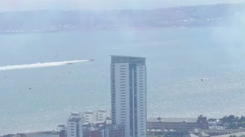 Red Arrows Plane stunt over city Stock Footage 65062445