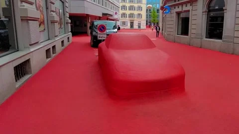 Red Art Installation Car Wrapped in Red Fabric on Swiss City Square 4K Stock Footage 340923704