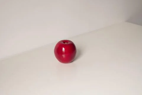 Red artificial apple on a white background, top view. Fotos Stock