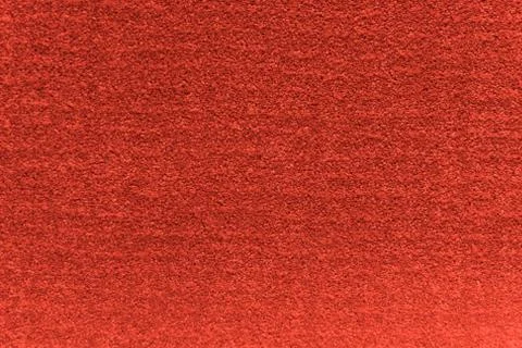 Red artificial carpet texture close-up, top view Stock Photos