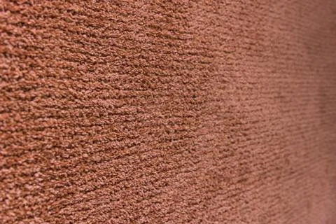 Red artificial carpet texture close-up, top view Stock Photos