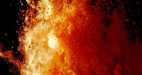 Red ash and glowing particles ascending from an explosion in slow motion Stock Footage 115163443