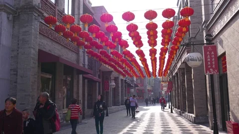 Red asian paper lanterns hanging over pedestrian shopping street, Beijing, China Stock Footage 104201193